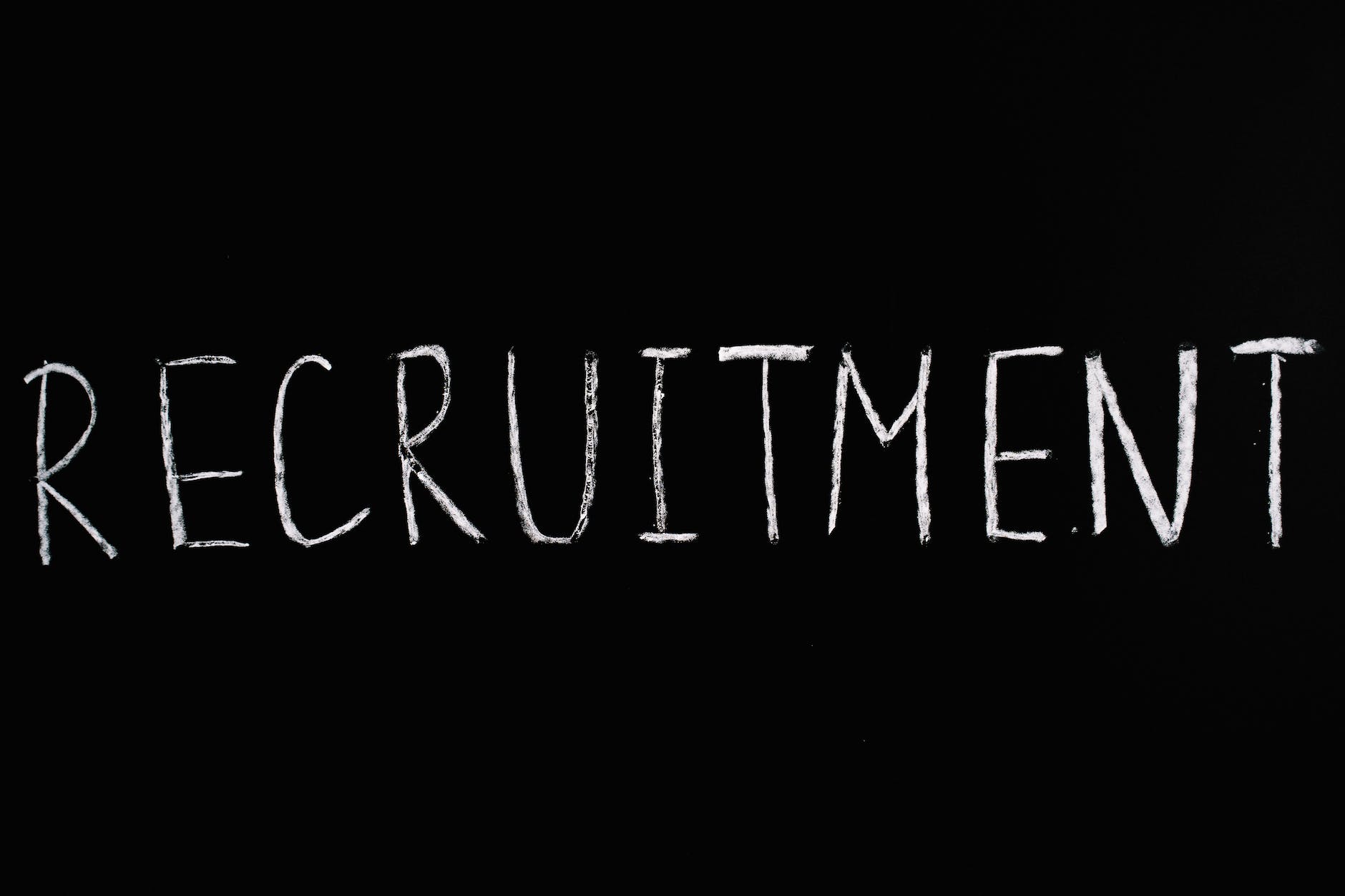 recruitment lettering text on black background